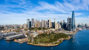 Aerial photo of the Barangaroo Reserve headland park on Sydney Harbour in the foreground, with Sydney’s central business district in the background.